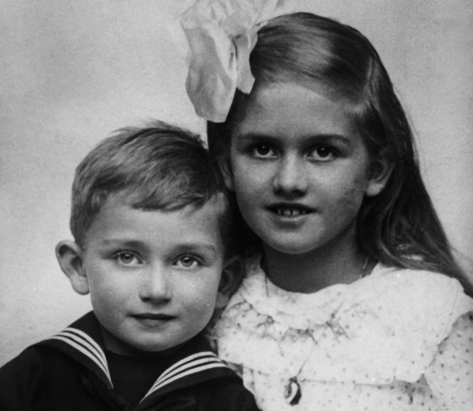 1915. Ferry Porsche with sister Louise, aged 6 and 11