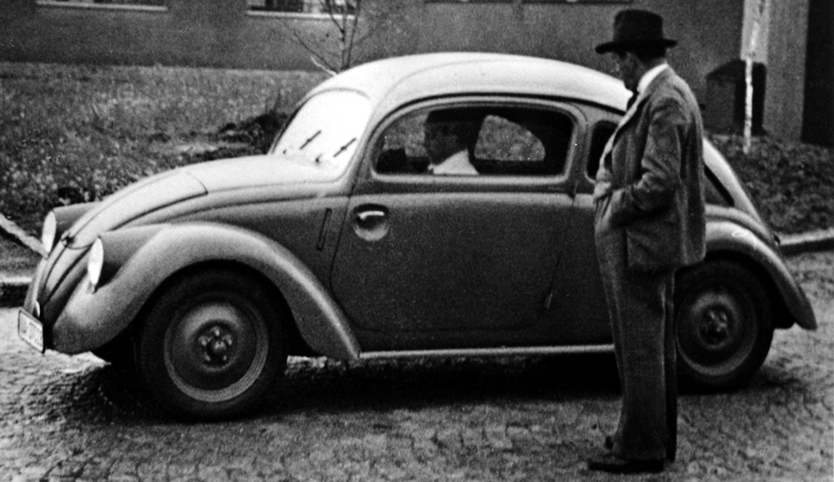 Ferdinand Porsche seen with a car from the W30 series of Volkswagen prototypes.