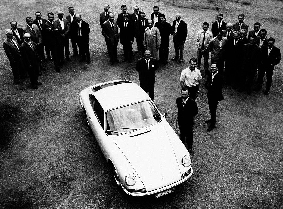 Porsche 901/911 development team: Karl Ruoff, Richard Hetmann, Leopold Jäntschke, Erich Stotz, Robert Binder, Rudolf Hofmann, Hans Herzog, Hans Hönick, Xaver Reimspieß, Alfred Kühn, Theo Bauer, Heinrich Klie, Edgar Tengler, Walter Payerbach, Erwin Komenda, Wilhelm Albrecht, Gottlob Sturm, Gerhard Schröder, Karl Mozelt, Hans Mezger, Ernst Weyersberg, Kurt Knörzer, Karl Metzger, Hans Martens, Helmuth Bott, Adolf Schneider, Herbert Linge, Schilling, Eberhard Stortz, Helmut Rombold, Hans Tomala, Ferdinand Piëch, Ferdinand Alexander Porsche, Ferry Porsche.