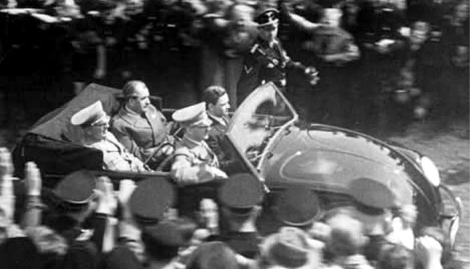 Robert Ley (head of KdF), Ferdinand Porsche and Adolf Hitler driven by Ferry Porsche.
