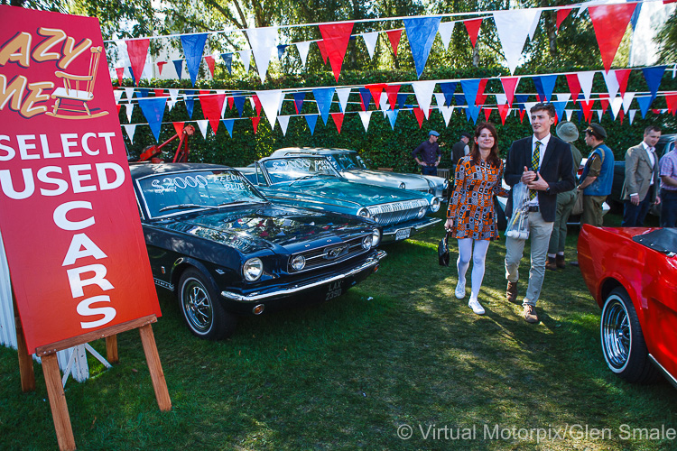 Typical '60s second-hand car lot with a young couple