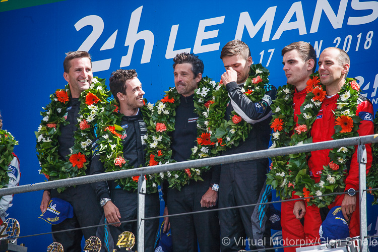 #77 Dempsey-Proton Racing Porsche 911 RSR on the podium, (from L-R) Christian Ried, Julien Andlauer, Patrick Dempsey and Matt Campbell #77 Dempsey-Proton Racing Porsche 911 RSR on the podium, (from L-R) Christian Ried, Julien Andlauer, Patrick Dempsey and Matt Campbell