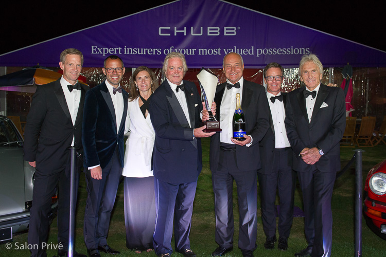 “Duke of Marlborough” award is handed to the owner of the red 1957 Porsche 356A Carrera Speedster by the Duke of Marlborough