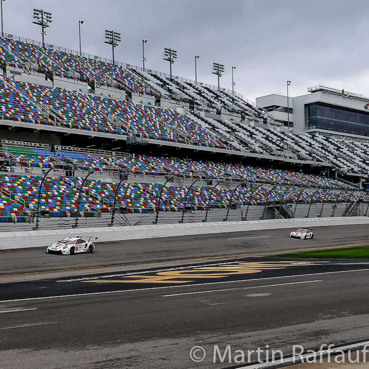 The two factory Porsches approach Turn 1 which leaves the oval at Daytona