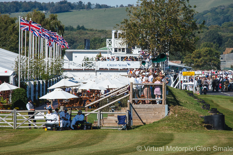 Union Jacks flutter in the wind above the Credit Suisse/Race Control building