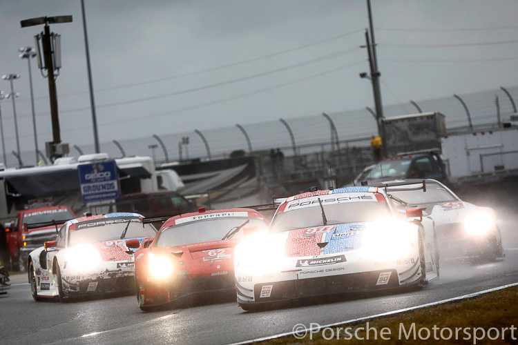 The #911 Porsche 911 RSR driven by Patrick Pilet, Nick Tandy and Frederic Makowiecki leads a pack of GTLM cars