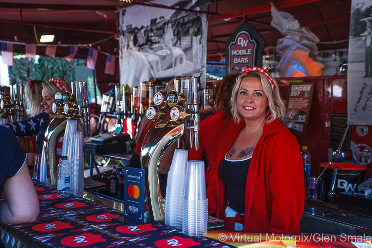 Despite a busy day serving others, this pretty barmaid readily raised a smile for the camera