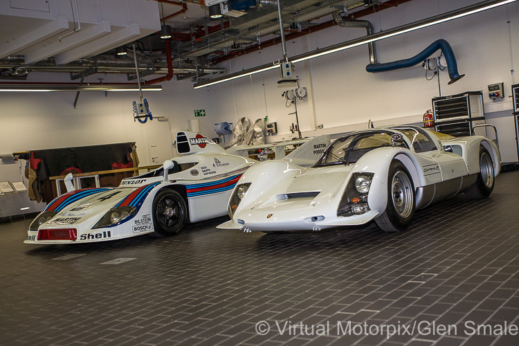 Two of Porsche’s historic racers awaiting attention inside the new Museum Workshop
