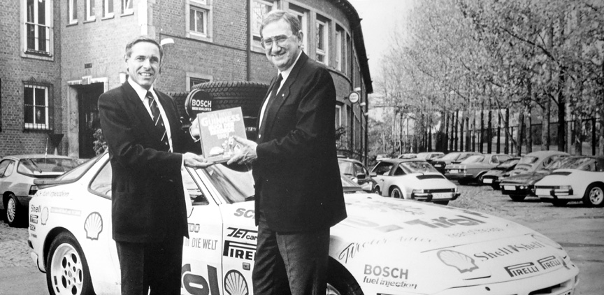 Endurance test driver Gerhard Plattner is thanked by Porsche CEO Peter W. Schutz.