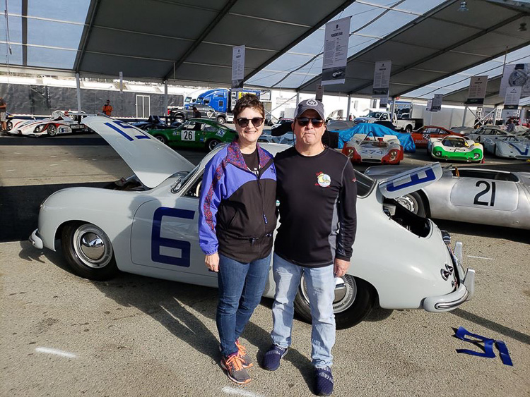 Mike and Kim Copperthite pause for a photo during the set up in the Chopard Heritage Display tent at the Porsche Rennsport Reunion VI, Laguna Seca, 2018