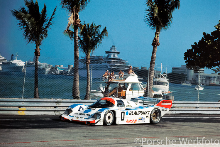 The Blaupunkt #0 Joest Racing Porsche 962 streaks past some sunbathers during the IMSA, Miami 3 Hour, 5 March 1989