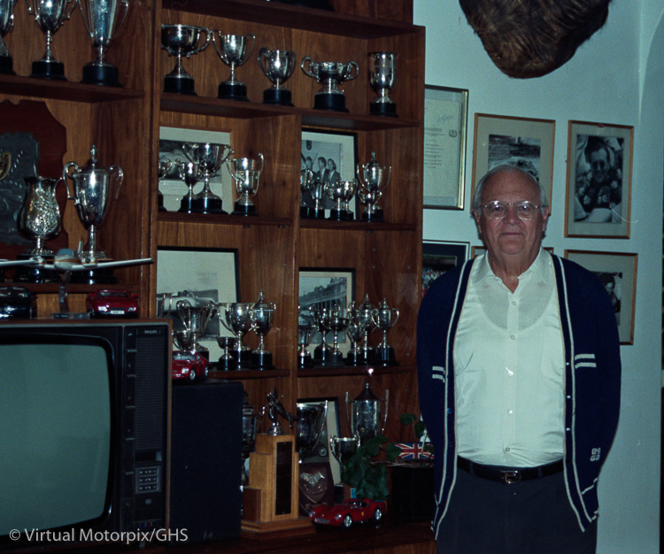 Ian Fraser-Jones stands proudly in his home in Johannesburg, South Africa with part of his large trophy haul, 1996