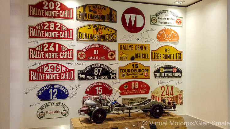 Today, the wall inside the workshop contains many more autographs and signatures