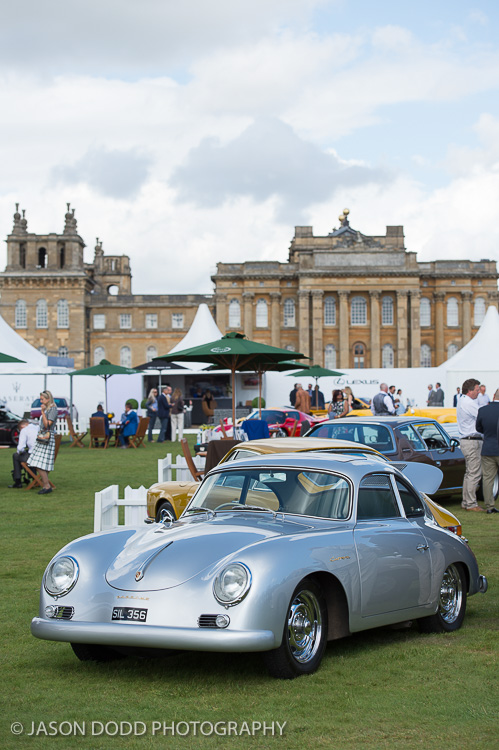 An early Porsche 356 Carrera with Blenheim Palace in the background