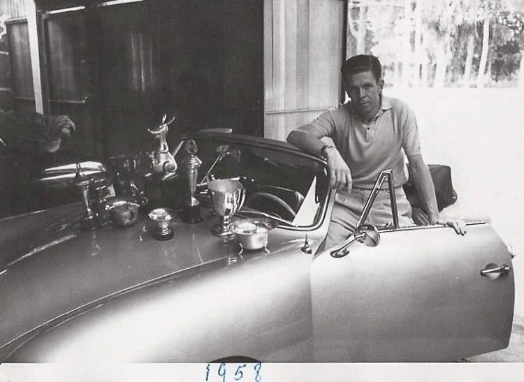 Bruno Krieger Sr., the first owner of the car, stands proudly with some of the trophies he won through rallying the car (1958)