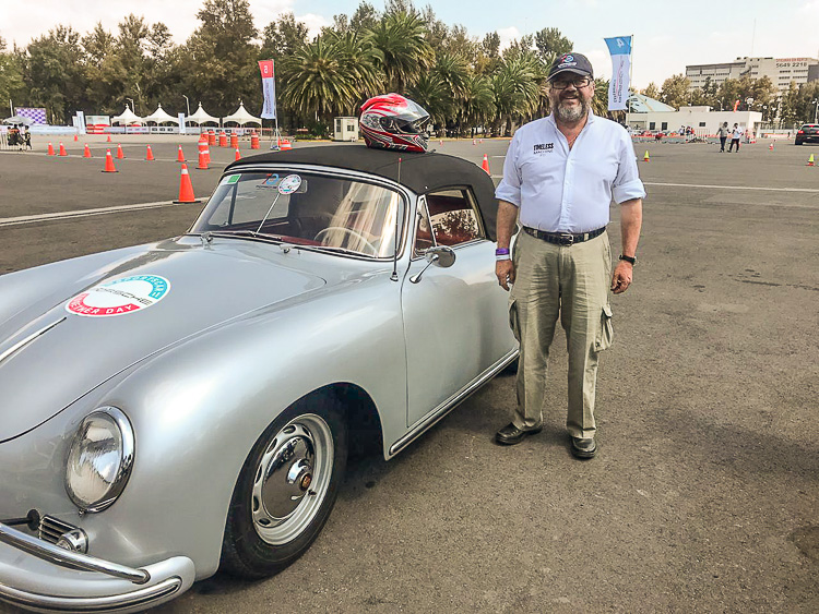 Francisco stands proudly with his car during the 2019 Porsche Parade
