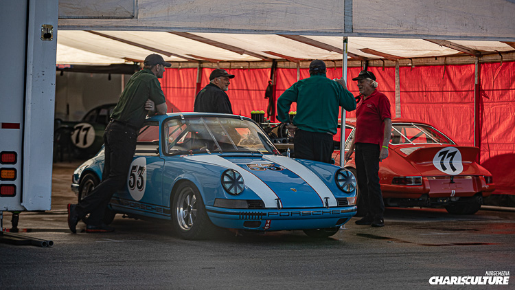 A pair of Porsche 911s awaiting their chance on track