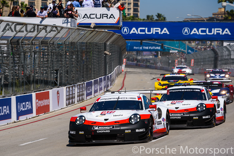 The #911 Porsche GT Team Porsche 911 RSR of Patrick Pilet and Nick Tandy leads the #912 of teammates Earl Bamber and Laurens Vanthoor away from the start