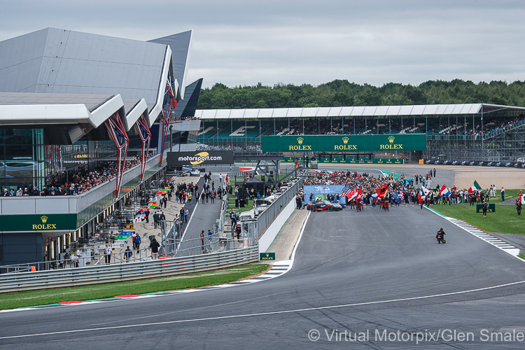 Crowds lining the spectator gallery of The Wing look down at the packed grid prior to the start of the race