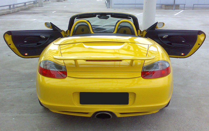 Yellow Porsche Boxster S 986.2 with aerokit