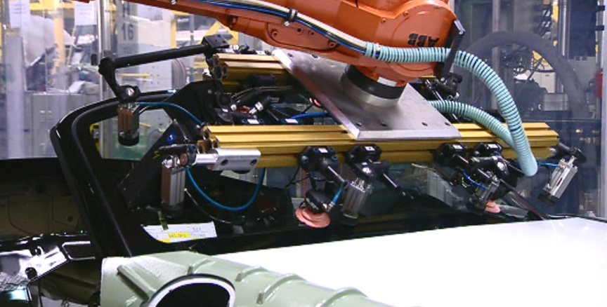Valmet Porsche Boxster factory, windscreen installation robot