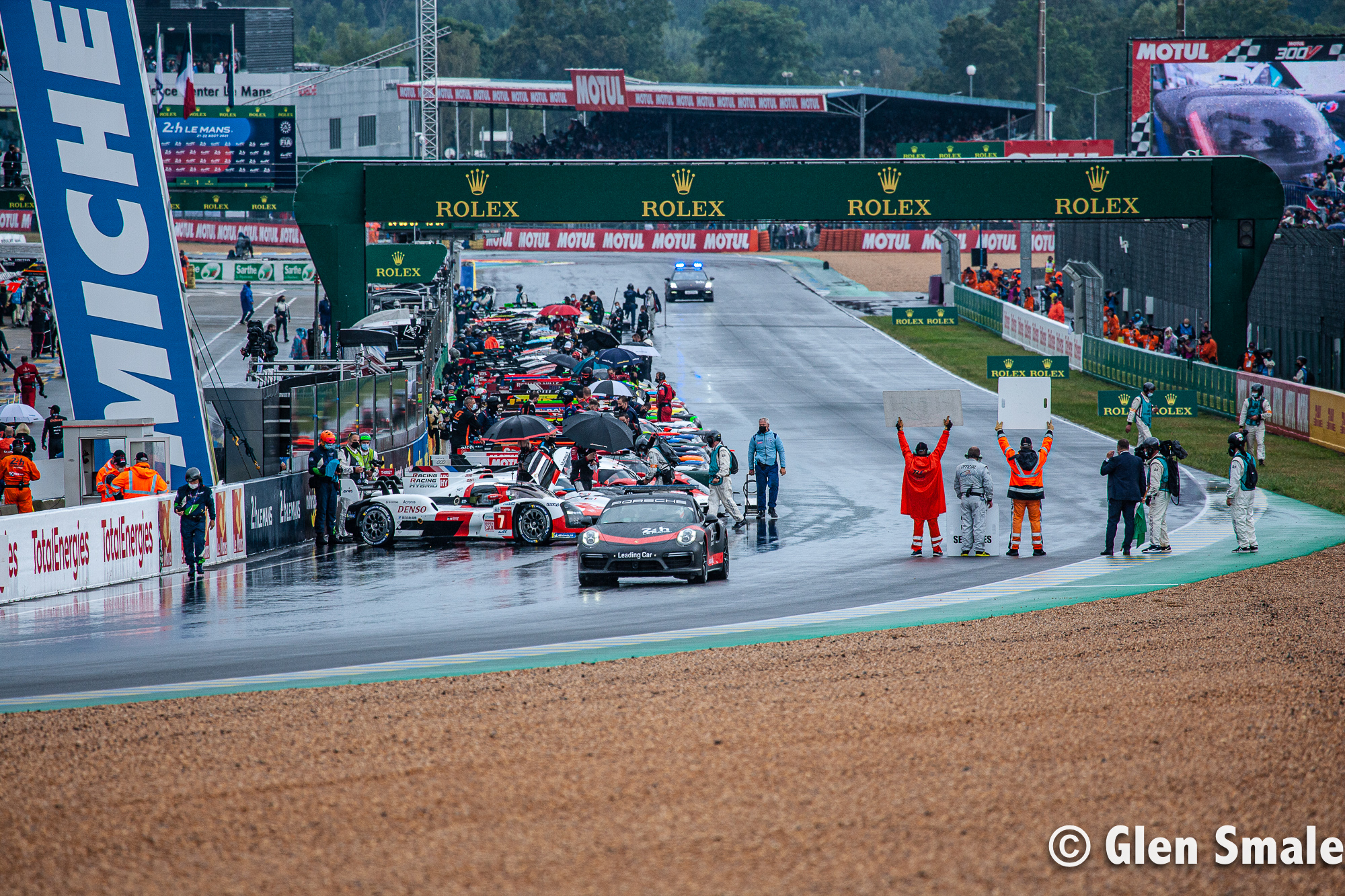 Race cars on the track at the start of 24 Hours of LeMans
