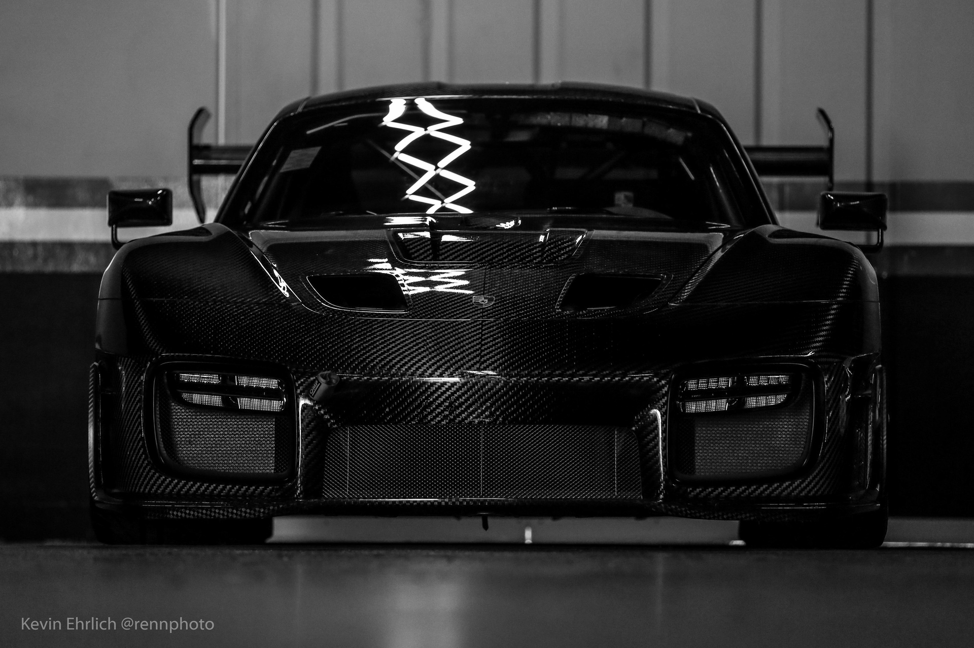 Front view of black carbon fiber Porsche 935/19