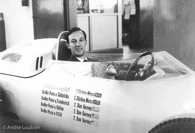 The author sitting in the car in which Stirling Moss won both the Cape Town and South African Grands Prix in December 1960