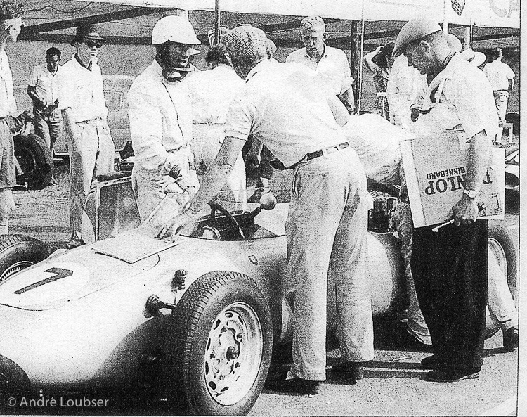 Stirling Moss and Huschke von Hanstein (with back to the camera) confer before the start of the South African Grand Prix at East London