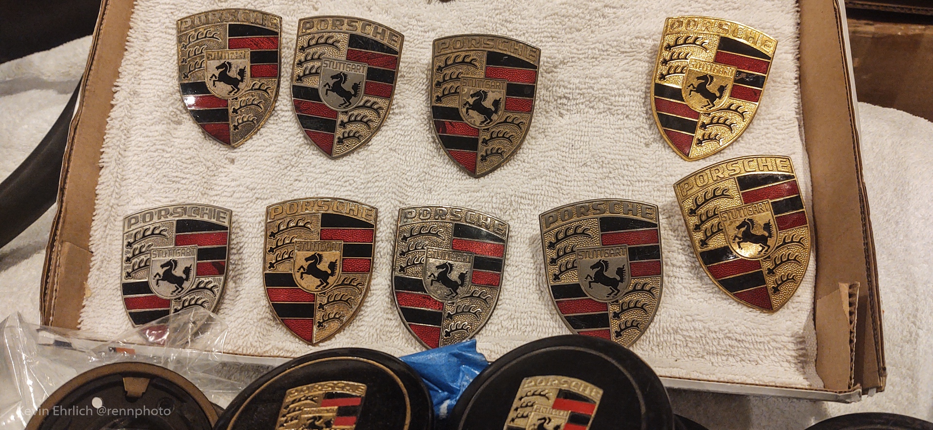 Porsche badges resting on towel in box