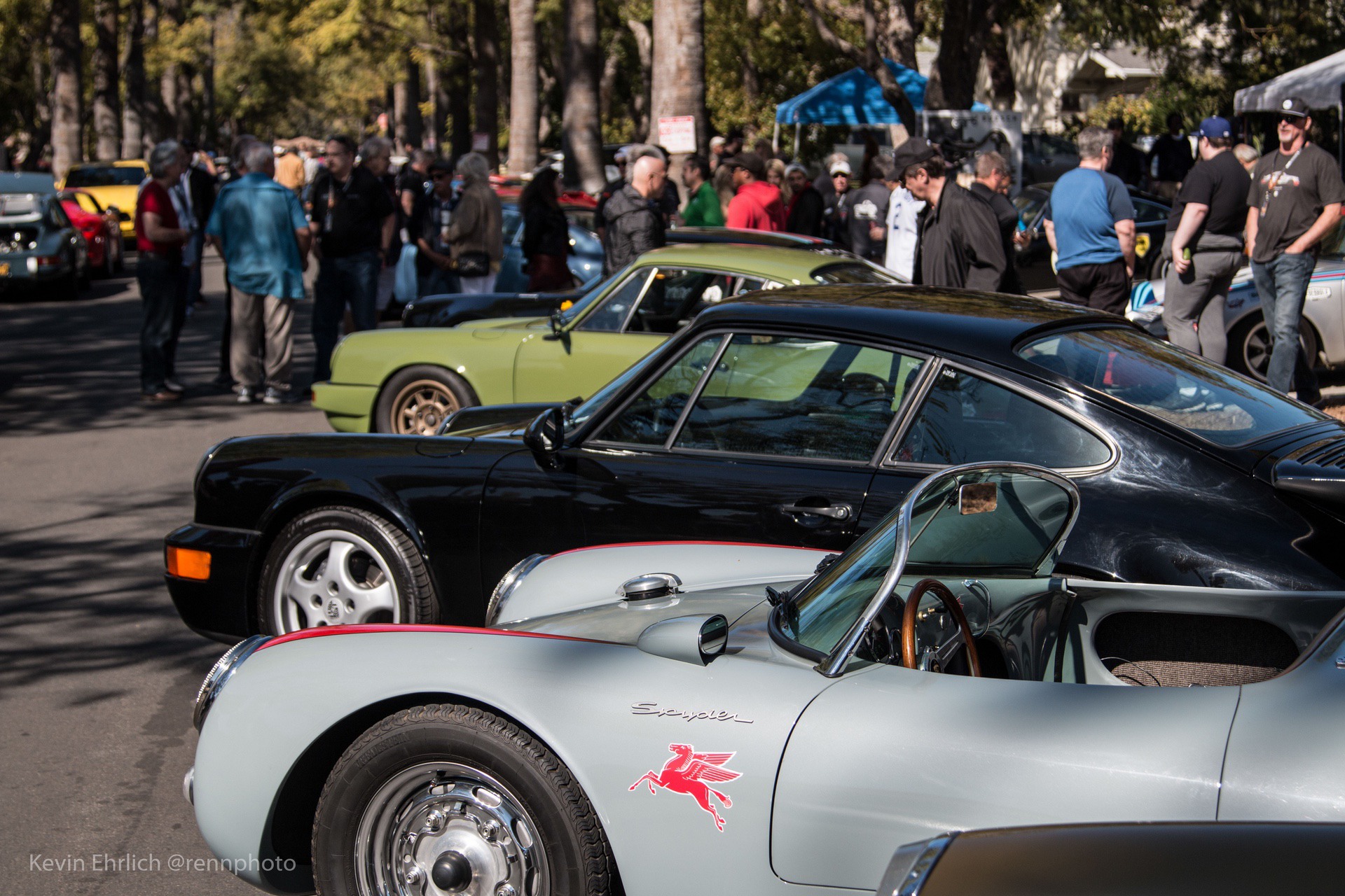 Row of vintage Porsche cars by side of road at 2022 LA Lit Show