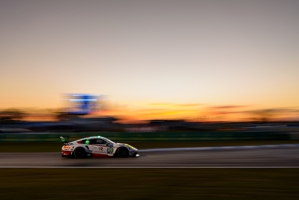 #99 Porsche on track at sunset during Sebring 2022