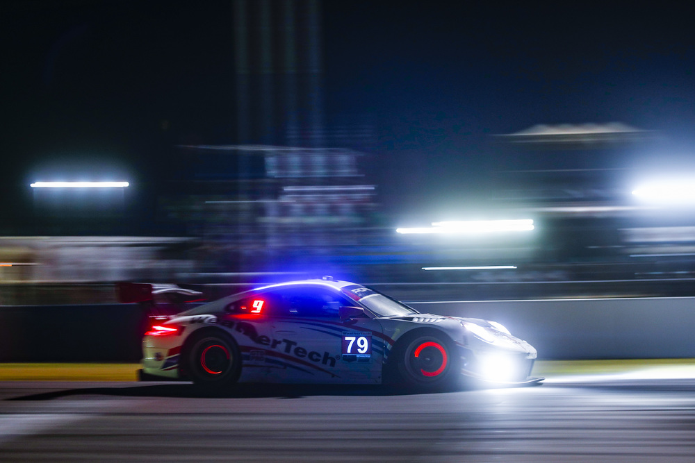 Porsche on track at night during Sebring 2022