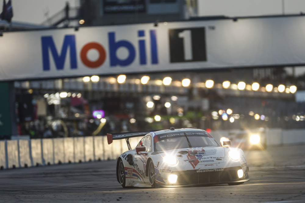 #79 WeatherTech Porsche on track at dusk during Sebring 2022