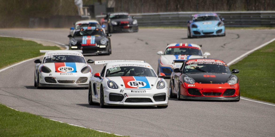 Various Porsche racecars on the track