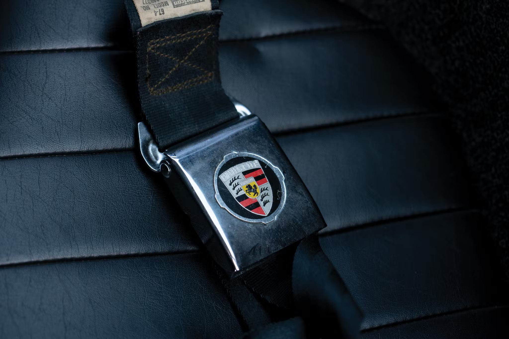 Closeup of Porsche seatbelt buckle