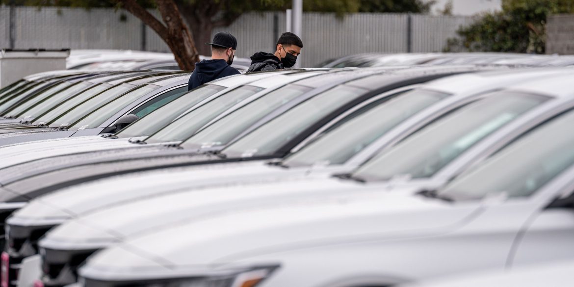 two buyers at a car lot