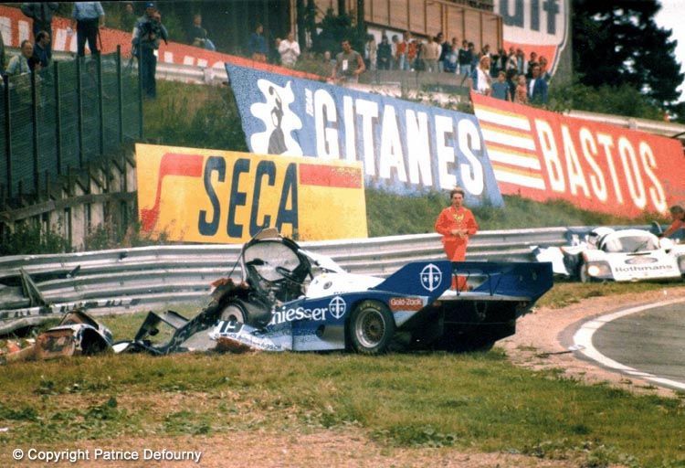 Crashed Porsche 956 on side of track