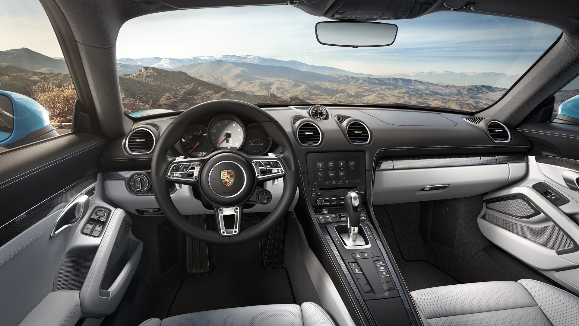 The Porsche 718 Cayman S interior. A little busier than the Lotus cabin, but still a lovely place to be, with everything slightly tilted towards the driver.