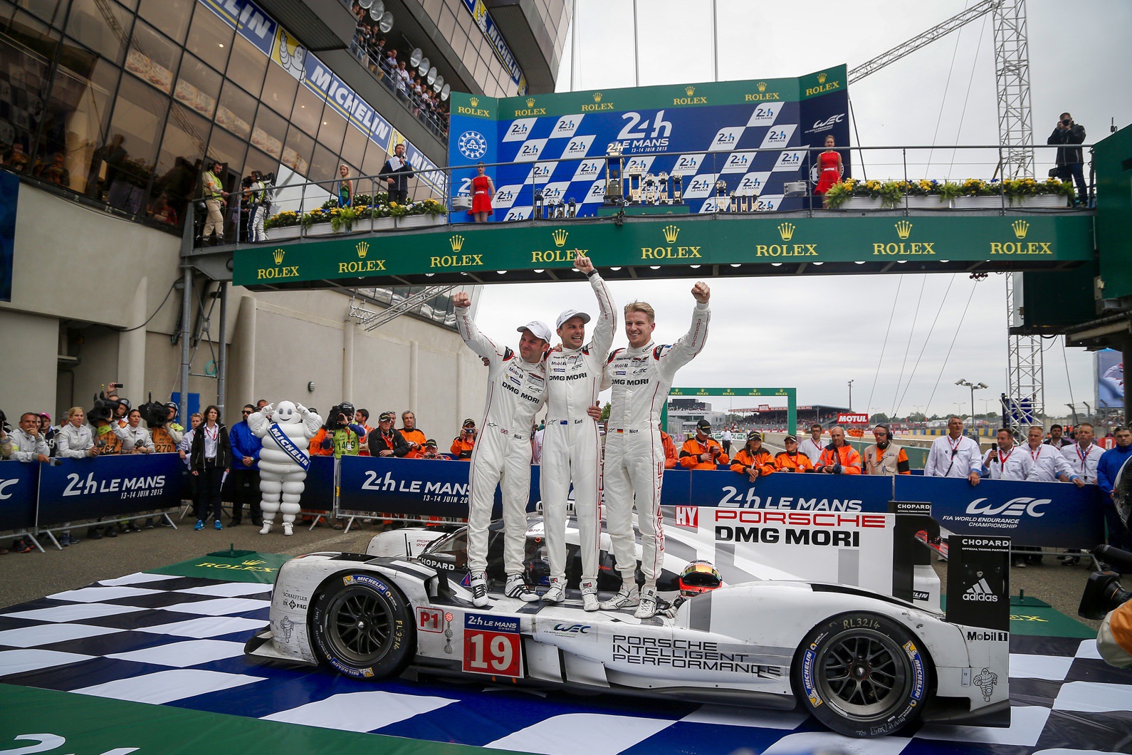 Left to right: Tandy, Bamber, Hulkenberg celebrate Porsche’s first 21st century overall win at Le Mans