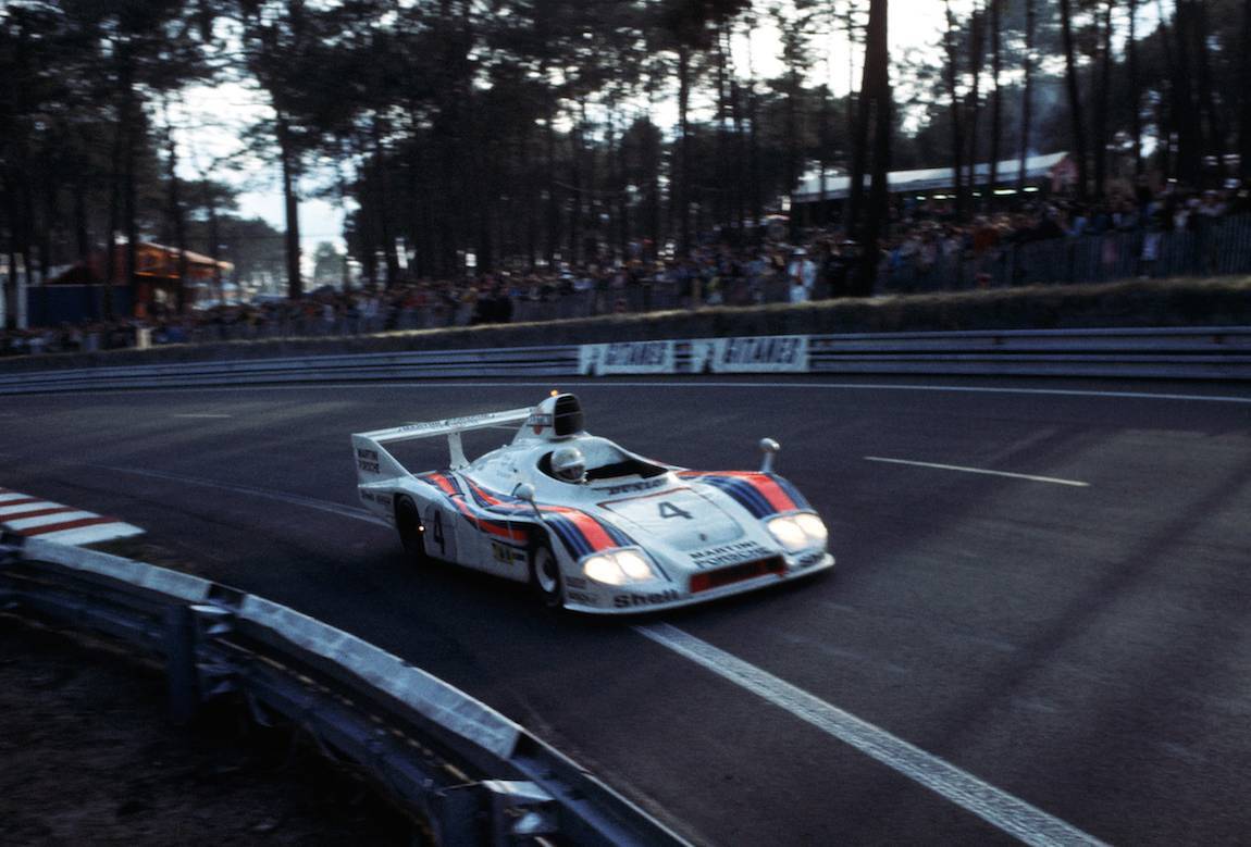 Jurgen Barth driving the #4 Martini-Porsche 936 into the early dusk hours