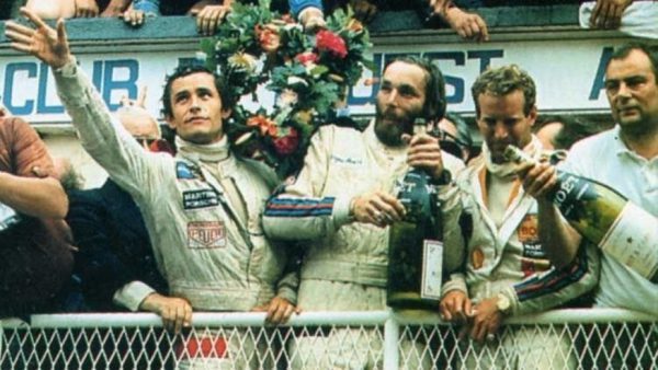 Jurgen Barth stands between Jacky Ickx (left) and Hurley Haywood (right) on the Le Mans podium