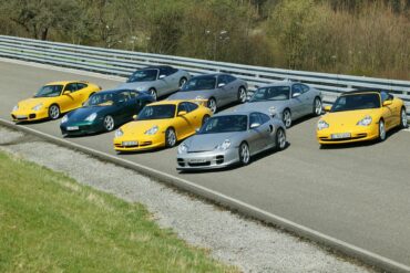 Complete Porsche 996 range in 2004 parked on road