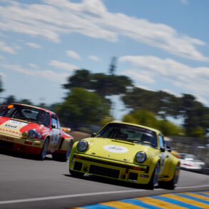 Porsches joust for position on the run down to Tertre Rouge, in the Porsche Classic Race.