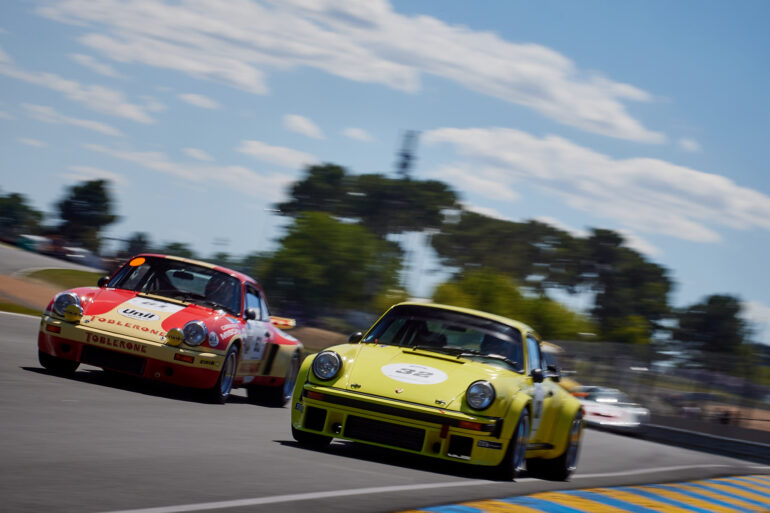 Porsches joust for position on the run down to Maison Blanche, in the Porsche Classic Race.