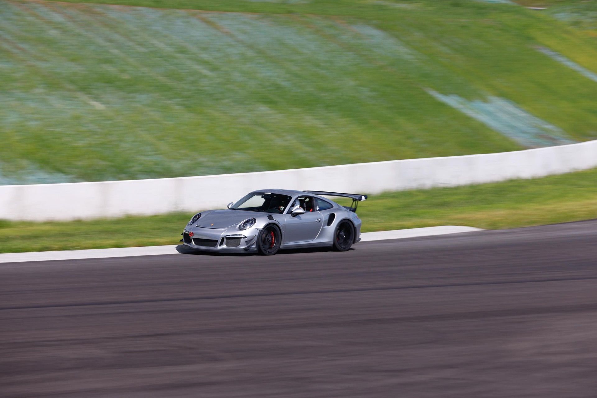High performance Porsche car on track during event