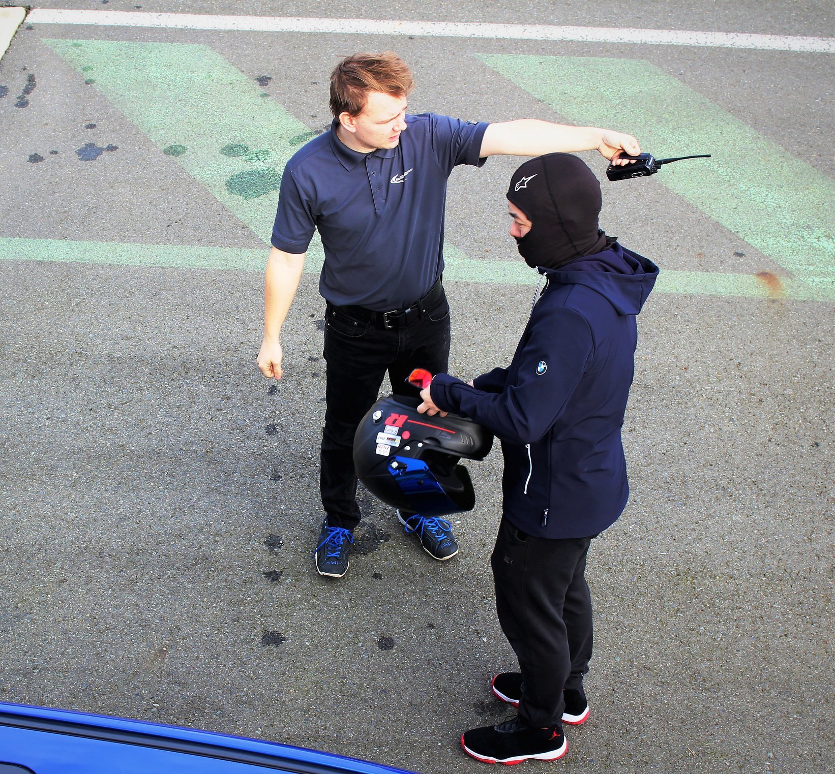 Instructor talking to driver during high performance driving event