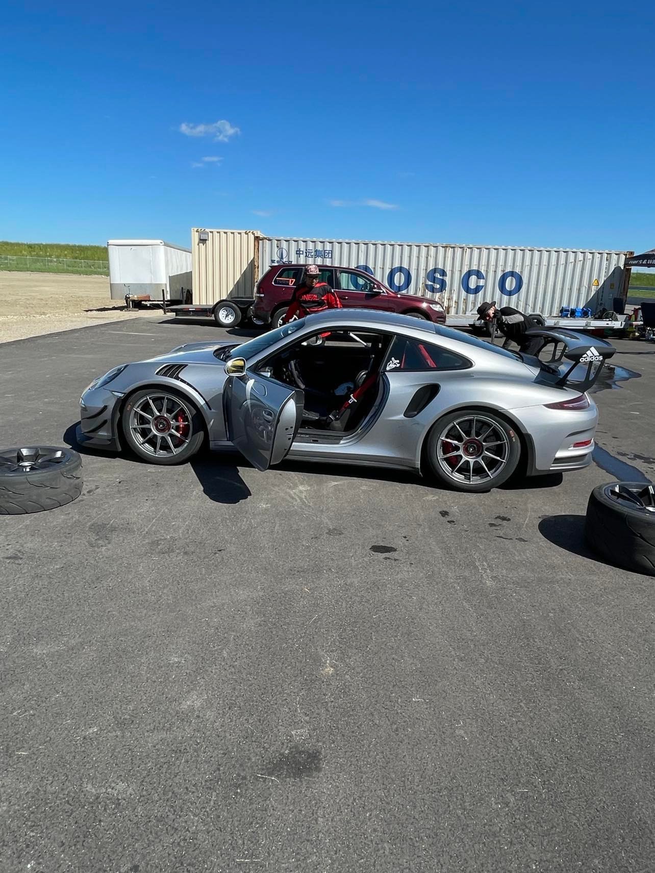 Porsche 991.1 GT3 RS at track with doors open