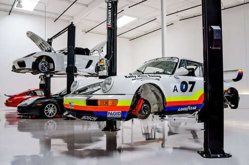 Porsche cars in E-Motion Engineering workshop