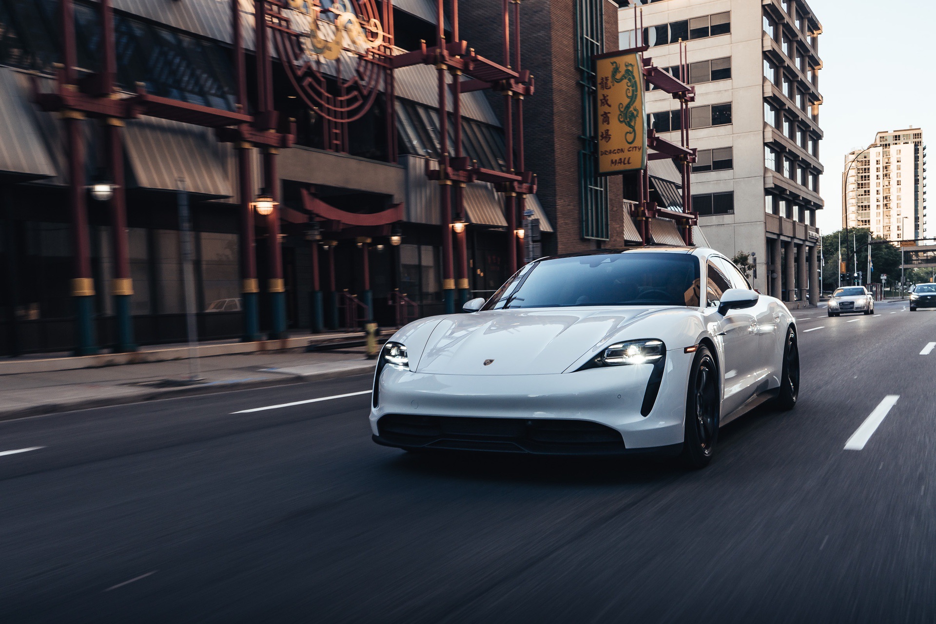 White Porsche Taycan on city street